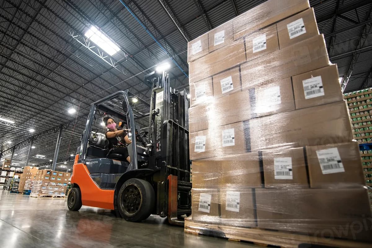 Warehouse with stacked cartons and a forklift